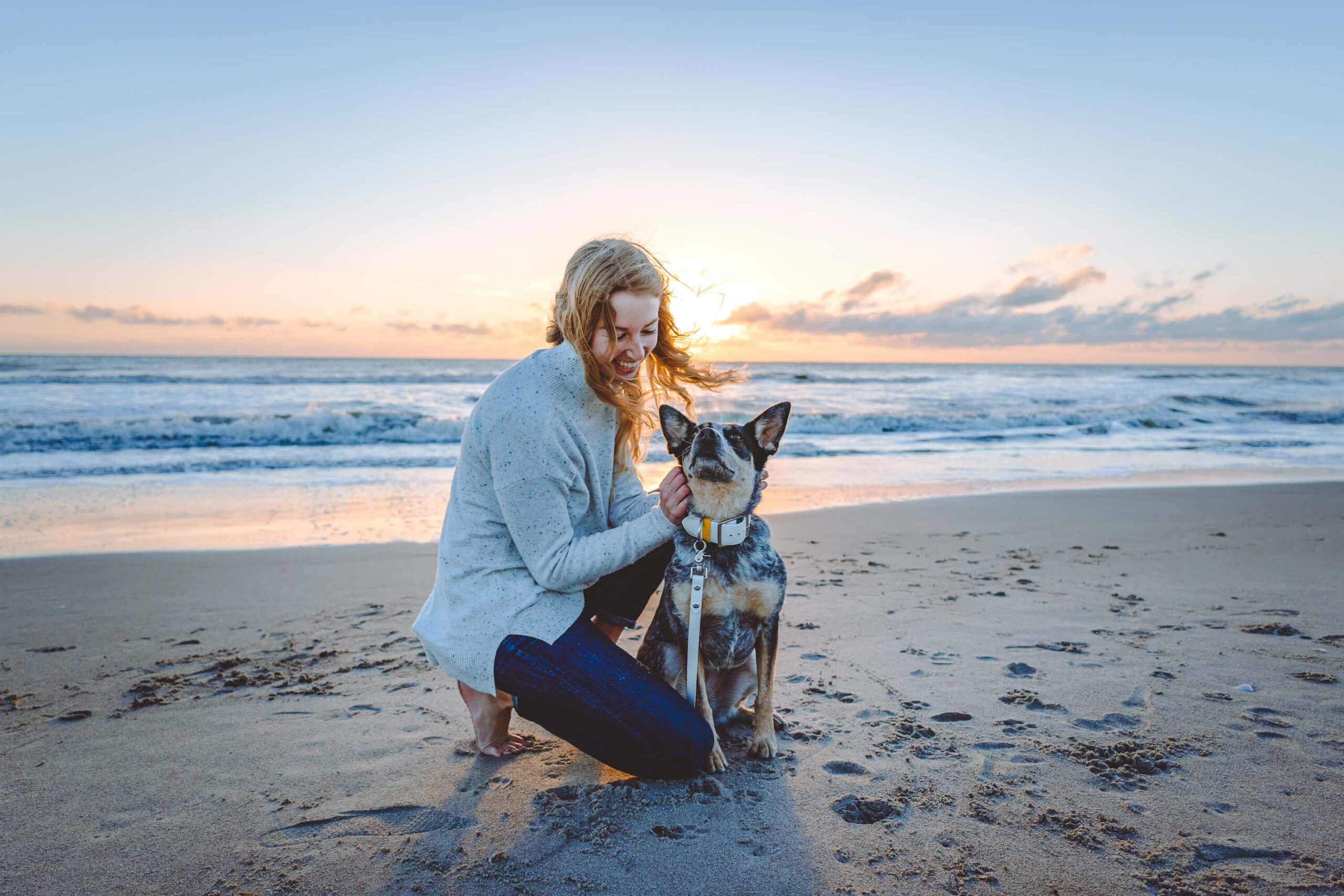 Haley Young and her dog, blue heeler Scout, on Cocoa Beach